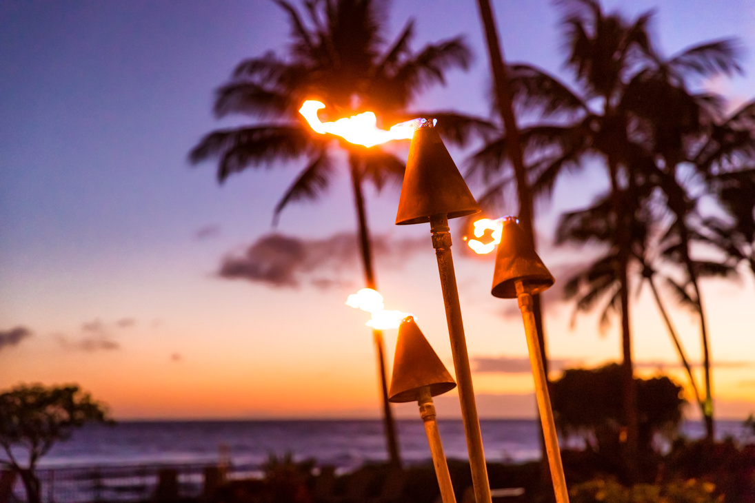 Fire Torches on the Beach at Sunset